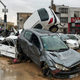 Floodwaters completely wrecked these vehicles Monday, March 26, 2019, in Shiraz, Iran.